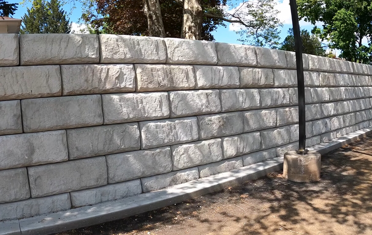 Retaining wall and concrete masonry construction